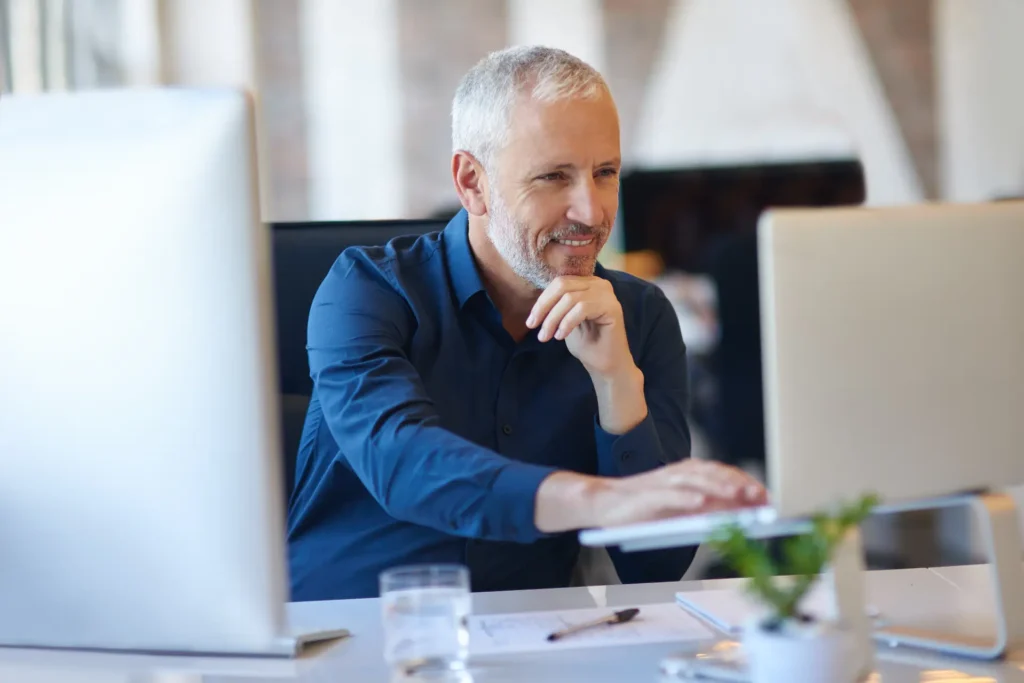 Businessman in a desk reading testimonials